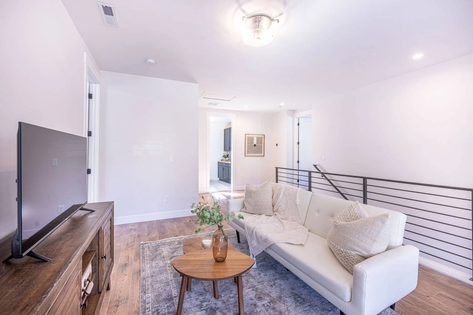 This spacious living room upstairs will be your perfect getaway during your vacation with an additional smart tv