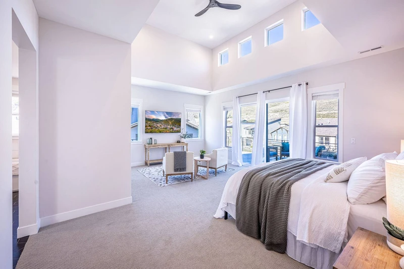 Unwind in the King-Sized comfort of this primary bedroom with it's own private balcony and streaming ready tv