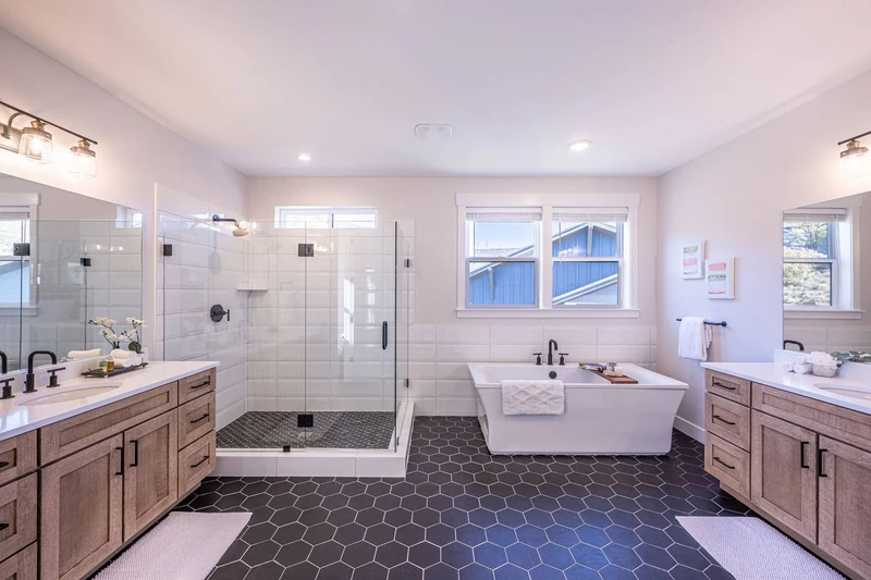 The primary suite's bathroom features an oversized free standing tub with 2 sinks and a large walk in shower