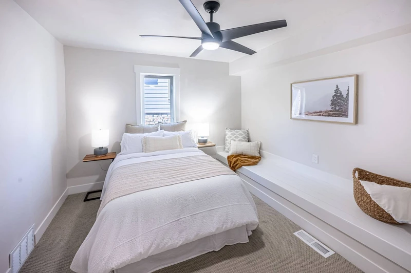 The queen sized bed is featured in the private bedroom off the theater room of the home