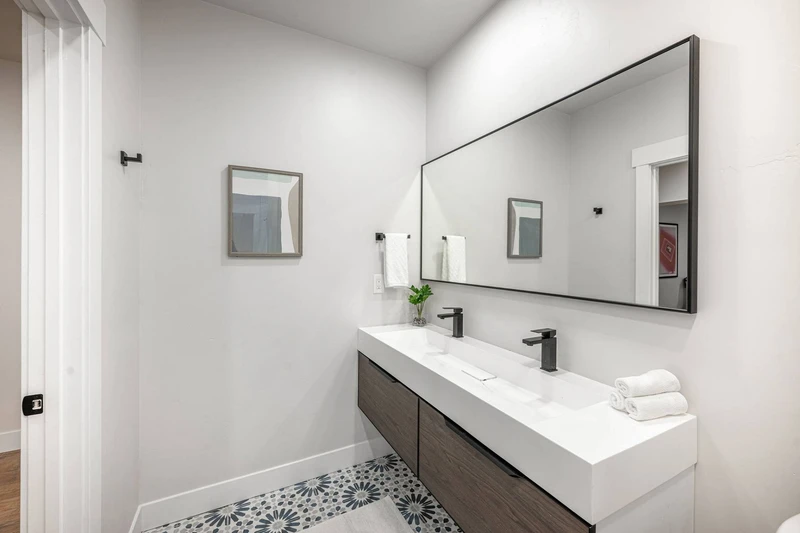 The jack-and-jill style bathroom is shared with the 2 bedrooms on the middle level of the home off the theater room