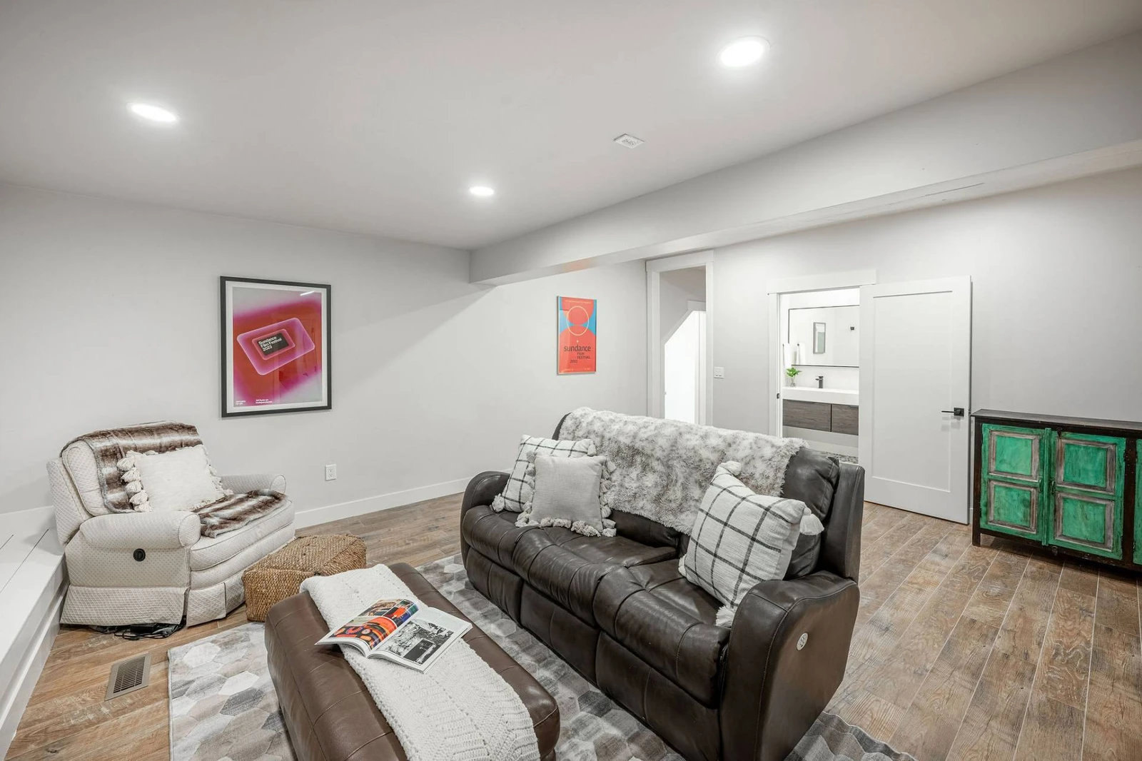 The theater room of the home has comfortable seating for guests while they enjoy a movie at home