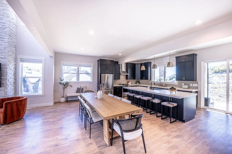 The open floor plan flows out to the back yard that features a private patio and the private hot tub with views of the mountains and the reservoir