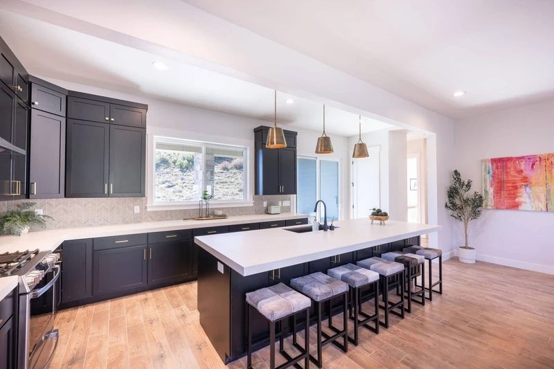 The oversized kitchen island has space to cook and seating for up to 6 guests at the breakfast bar