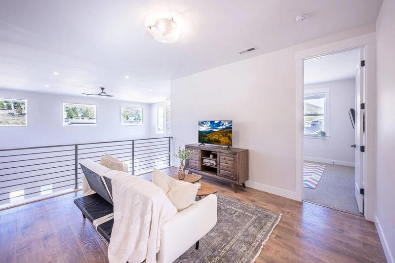 Upstairs Living Room with Streaming-Ready TV and a comfortable sofa