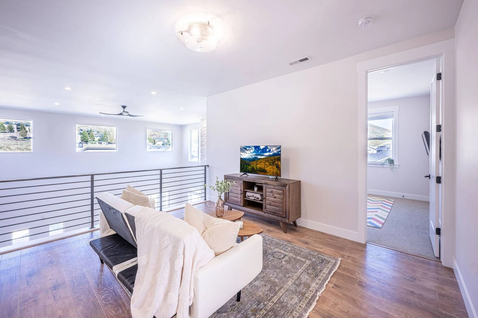 Upstairs Living Room with Streaming-Ready TV and a comfortable sofa