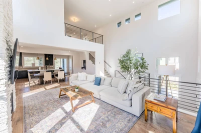 The Gathering House Great Room — 3 stories, open floor plan, loft above, kitchen flow, seats twelve