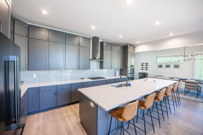 Gourmet Chef's Kitchen: Fully-Equipped Modern Space with 5-Seat Breakfast Bar. We provide cooking equipment so you don't have to bring anything from h