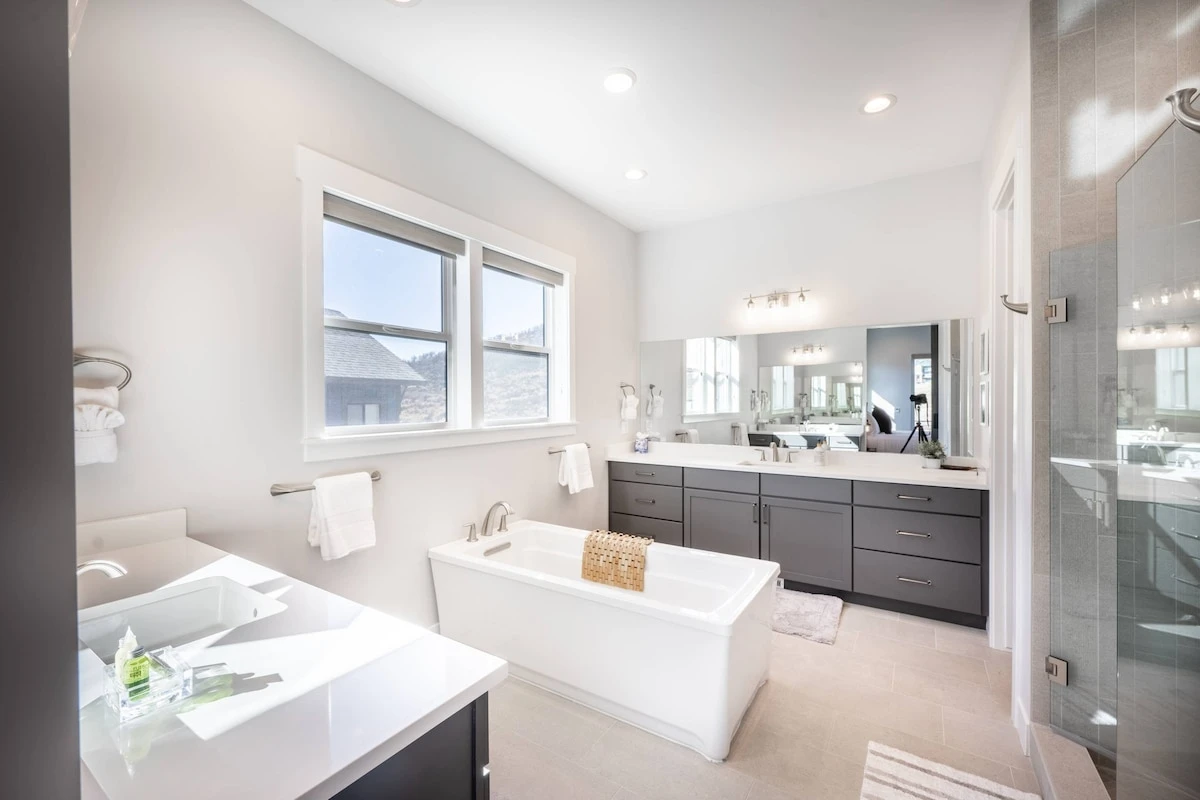Relax in the luxurious primary ensuite oversized soaker tub which also offers 2 large sinks and vanities, and a walk in shower