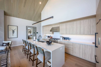 Modern kitchen with large island in Deer Valley East Village vacation rental