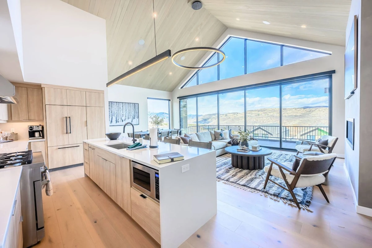 Kitchen with gas range and island seating in Park City luxury vacation home