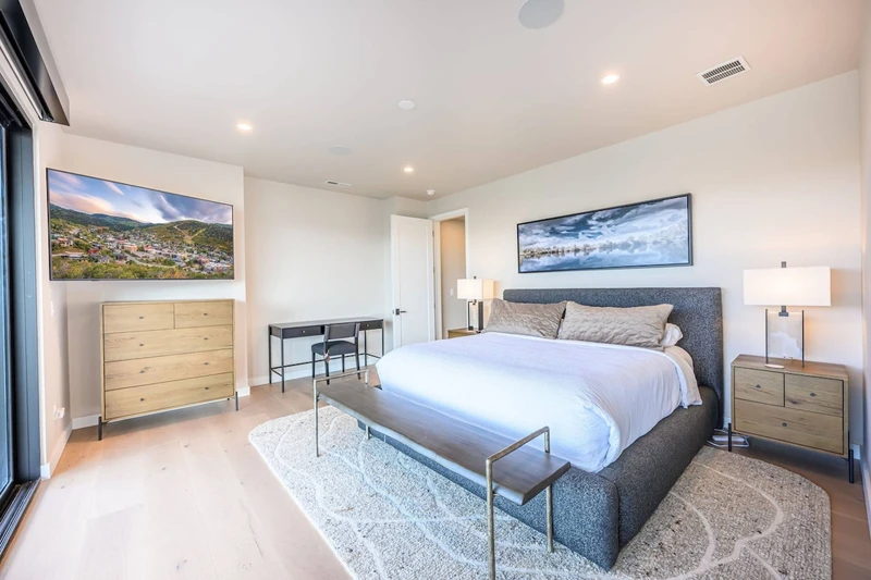 Primary bedroom with deck access and mountain views near Jordanelle Reservoir