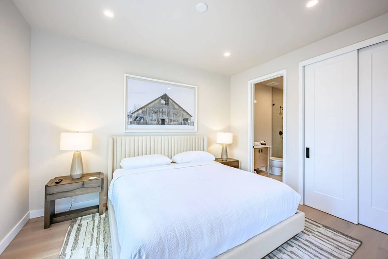 Guest bedroom with king bed and blackout shades in Park City vacation rental