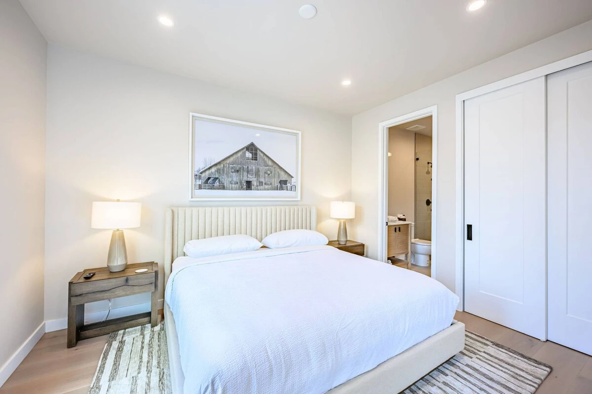 Guest bedroom with king bed and blackout shades in Park City vacation rental