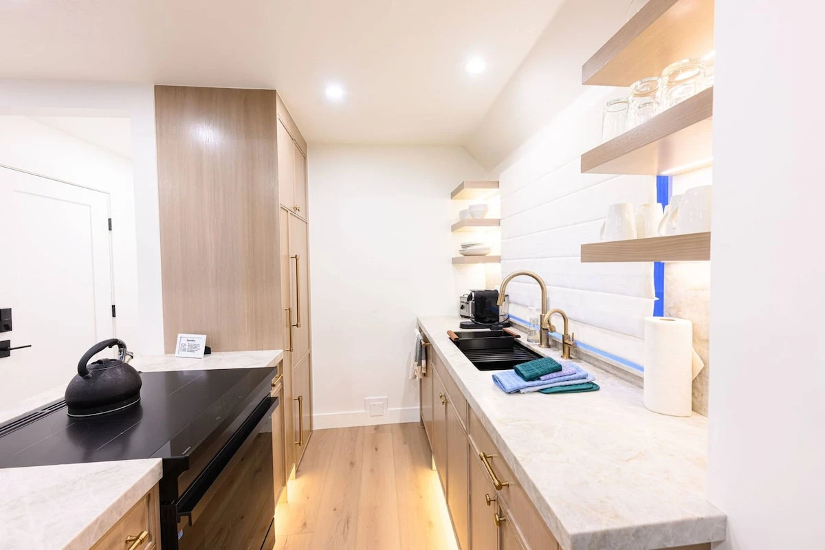Kitchen with full-size appliances and counter space for meal preparation.