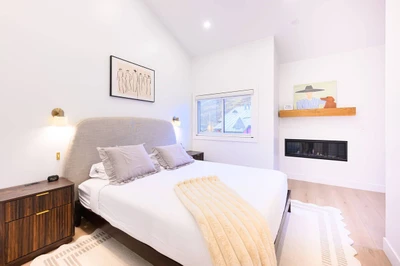 Primary Suite with king size bed and attached bathroom.