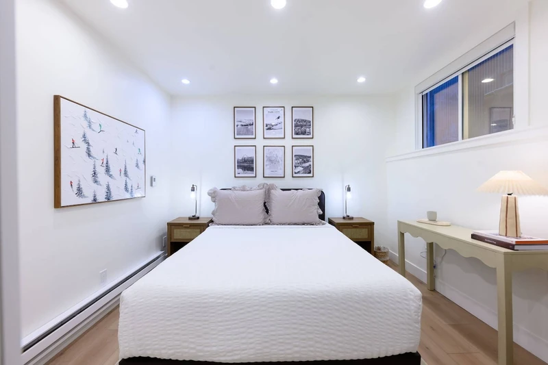 Beds made with clean, triple-sheeted bedding.