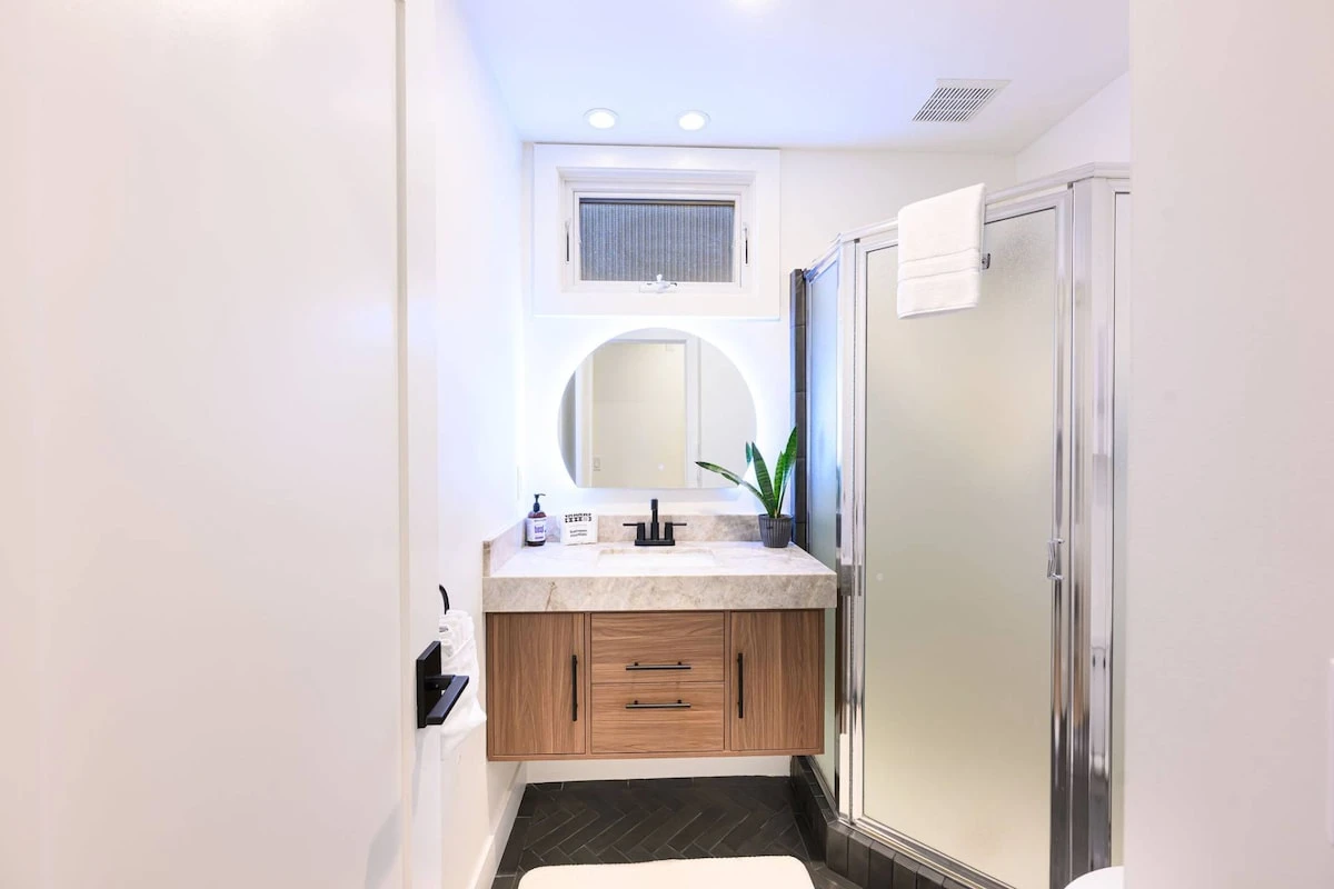 Bathroom with fresh towels and standard amenities.