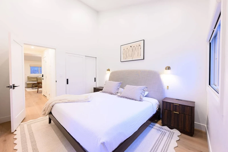 Beds made with clean, triple-sheeted bedding.