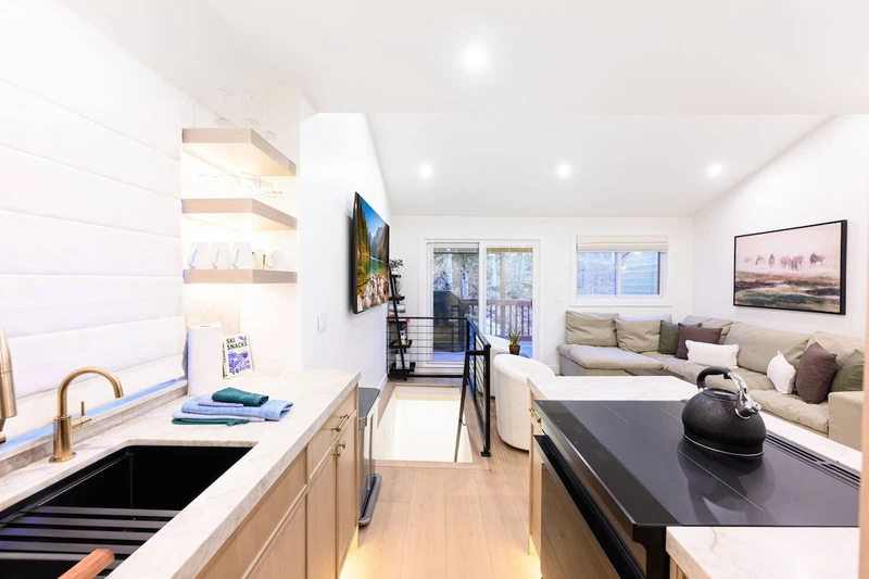 Open-concept living space connecting kitchen and dining area.