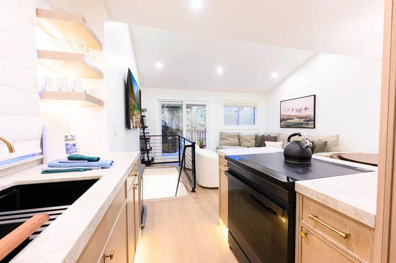 Open-concept living space connecting kitchen and dining area.