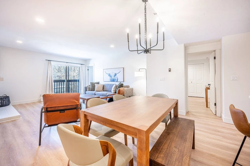 Dining area with table seating, located adjacent to the kitchen and living space. Home professionally cleaned prior to arrival.