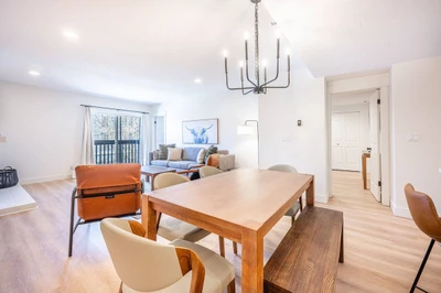 Dining area with table seating, located adjacent to the kitchen and living space. Home professionally cleaned prior to arrival.