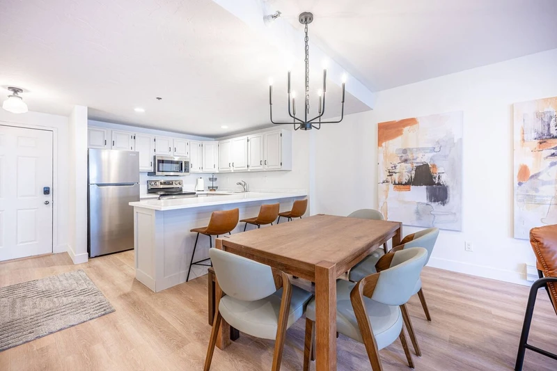 Dining area with table seating, located adjacent to the kitchen and living space. (different angles)