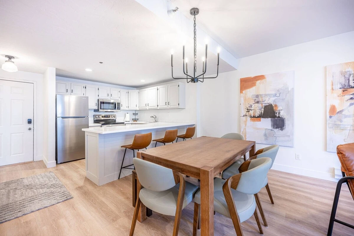Dining area with table seating, located adjacent to the kitchen and living space. (different angles)