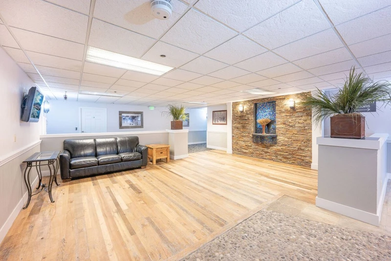 Snow Blaze Condos Park City Lobby with Leather sofa, hardwood flooring and TV