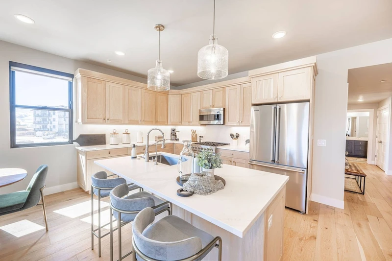 Gourmet kitchen with Quartz island, breakfast bar and Viking appliances in Deer Valley East 3-bedroom condo at Mayflower Lakeside
