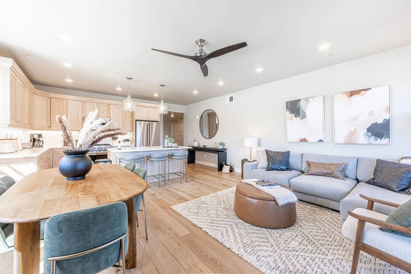 Mountain-modern living room in Deer Valley East Mayflower Lakeside condo with plush seating and natural light.