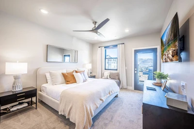Primary king suite in Deer Valley East 3-bedroom condo with premium bedding and mountain-modern décor at Mayflower Lakeside.Mountain and Lake Views,