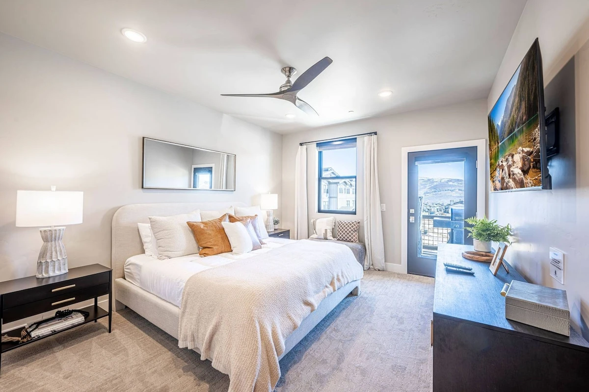 Primary king suite in Deer Valley East 3-bedroom condo with premium bedding and mountain-modern décor at Mayflower Lakeside.Mountain and Lake Views,