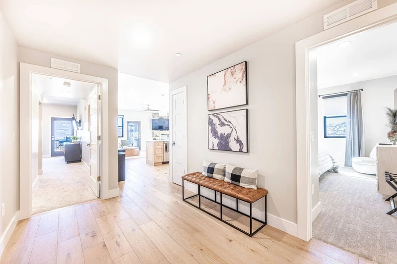 The airy entry way welcome guests to this modern home with a comfortable bench