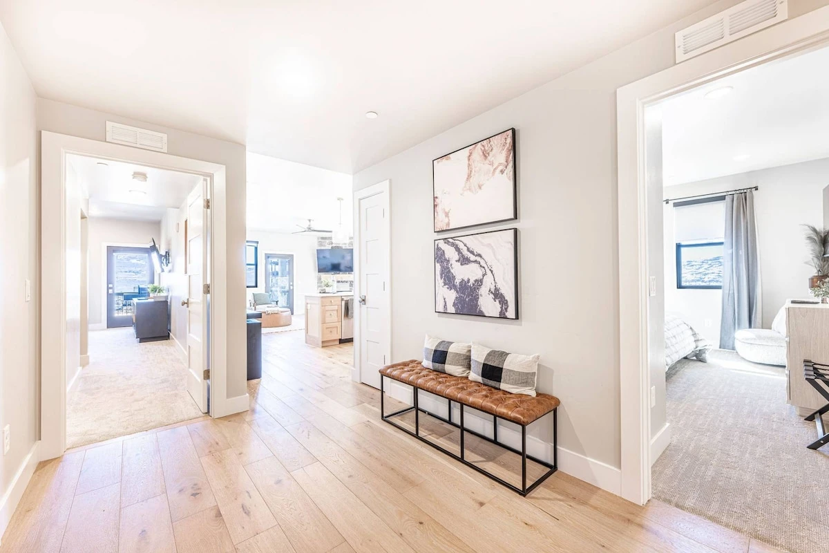 The airy entry way welcome guests to this modern home with a comfortable bench