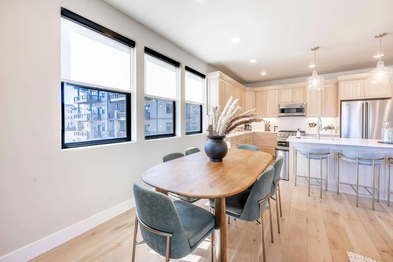 Dining area for six in Deer Valley East Mayflower Lakeside condo with open floor plan and mountain views