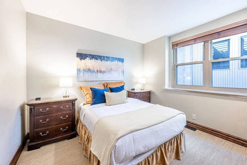 Main Level guest bedroom with comfortable queen bed.