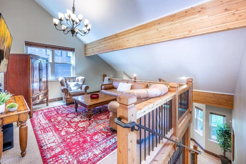 Overlooking the living room is a spacious loft with HDTV and comfortable seating.