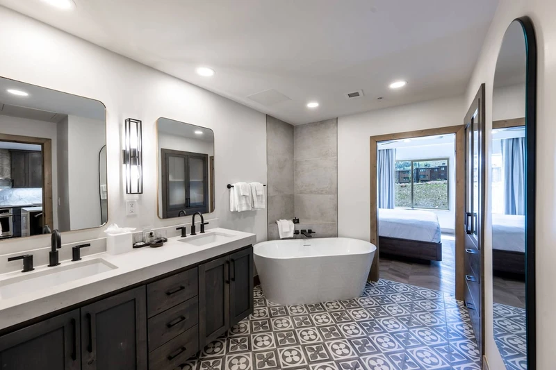Relax in this gorgeous freestanding bath tub in the modern primary bathroom