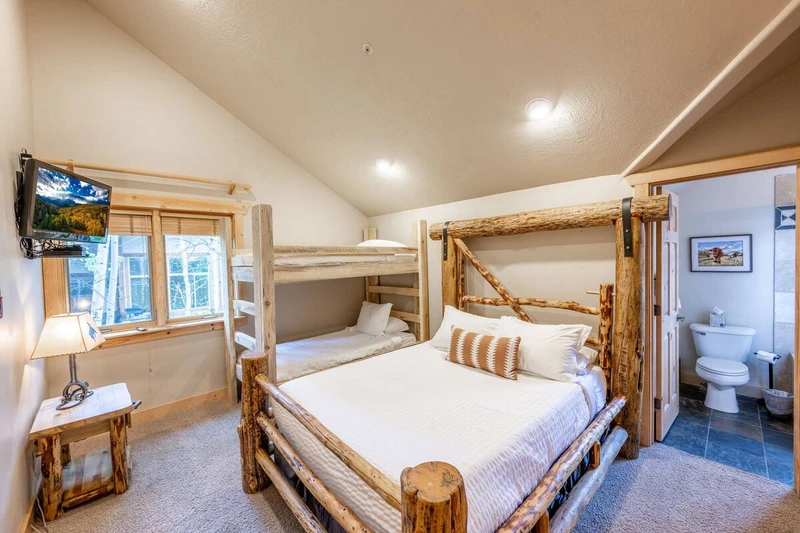 The guest suite features an en suite bathroom, a bunk bed with 2 twin beds, and a full sized bed, perfect for 4 guests