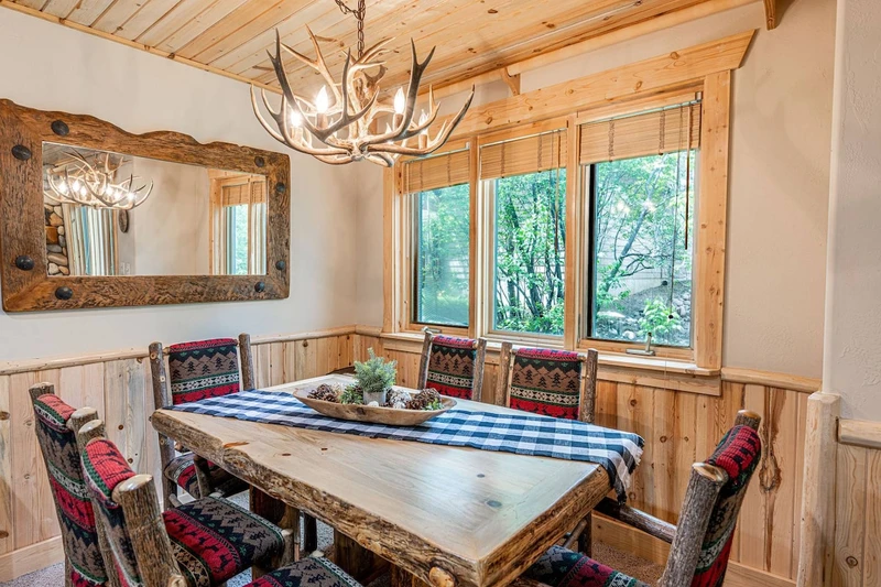 The dining room table is just off the kitchen and has comfortable seating for 6 guests.