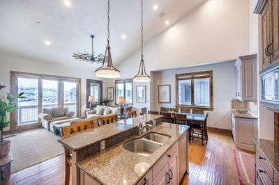The open floor plan is perfect for gathering - the living, dining and kitchen flow seamlessly and are perfect for family gatherings.
