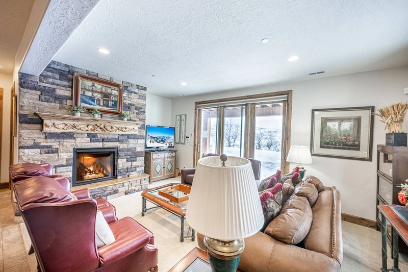 The Lounge Level Family Room is perfect for family time - Gas Fireplace, Xbox, Patio Access, Game Table, and patio access