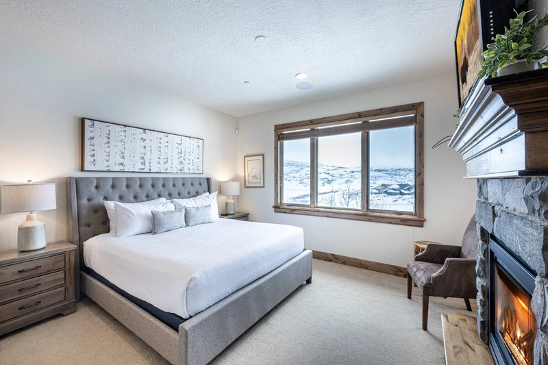 Main Level Primary suite with King bed, gas fireplace, hdtv and views.