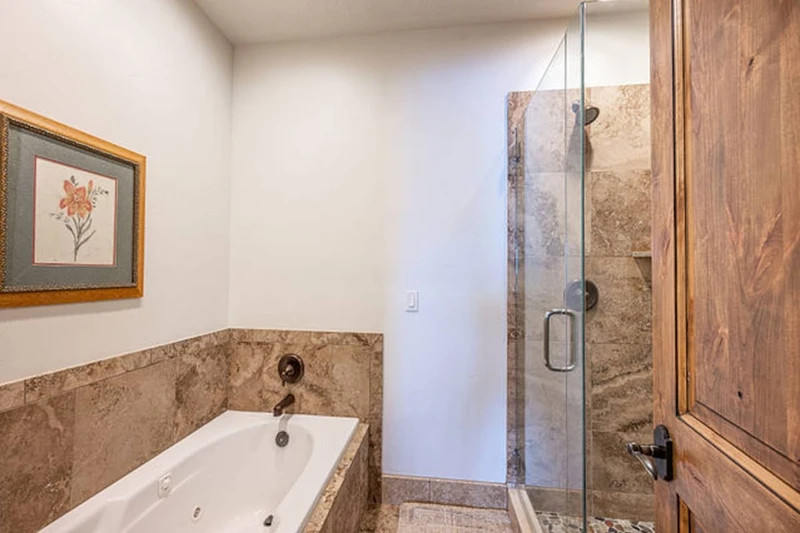 En Suite Primary Bathroom with Jetted tub and Walk in Glass Shower