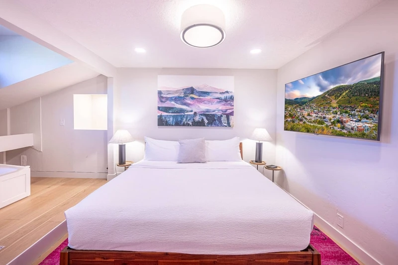 Primary king suite at the Prospector Penthouse in Park City with a King bed, Japanese soaking tub and HDTV. A spa-style en-suite bathroom for unwinding after skiing Park City Mountain or a day of summer hiking and biking.