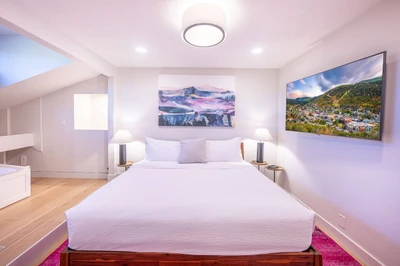 Primary king suite at the Prospector Penthouse in Park City with a King bed, Japanese soaking tub and HDTV. A spa-style en-suite bathroom for unwinding after skiing Park City Mountain or a day of summer hiking and biking.