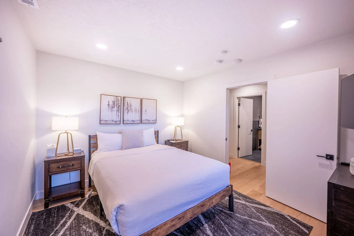 The guest room features a Queen bed, HDTV, closet, dresser and a unique reading area.