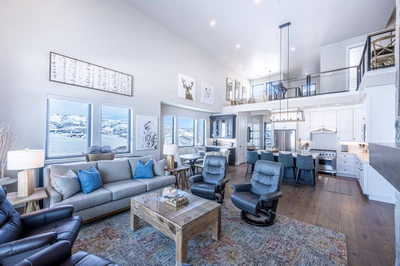 Open-concept living space designed for large group stays in Park City near Deer Valley. Mountain and Jordanelle Lake Views